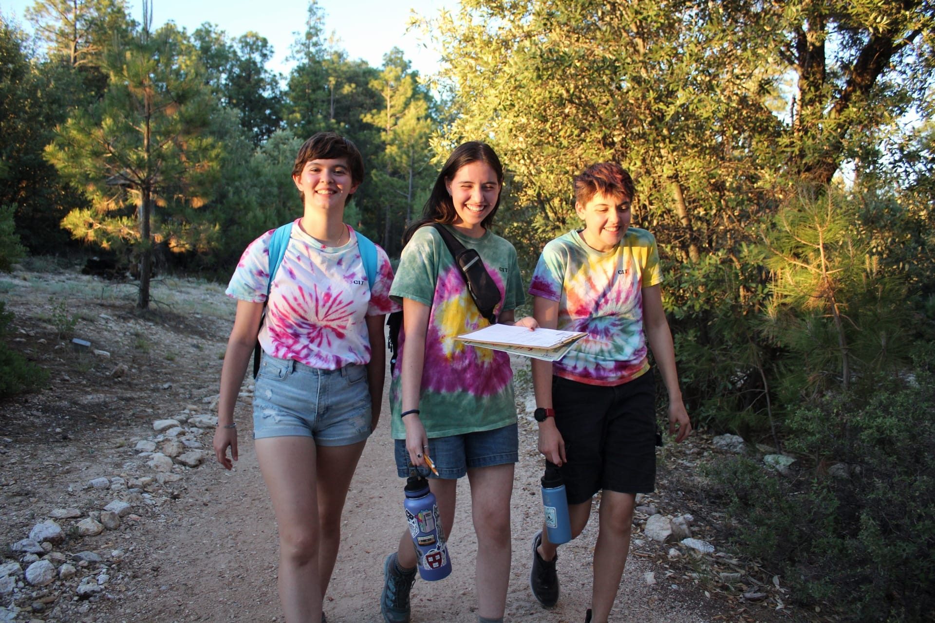 CIT girl scouts hiking and smiling