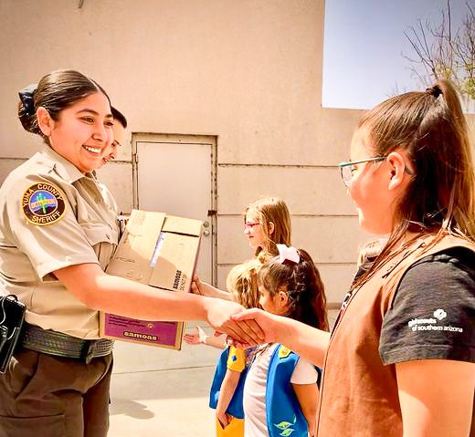 girl scouts delivering cookies to yuma police