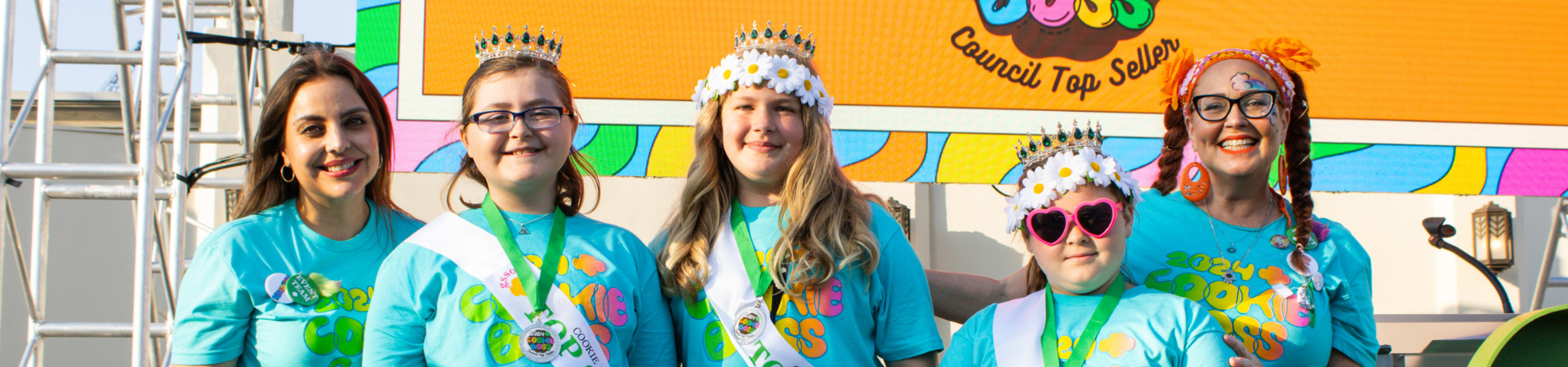  girl scout wearing uniform sash putting trefoil girl scout cookie boxes into cookie transport bag 