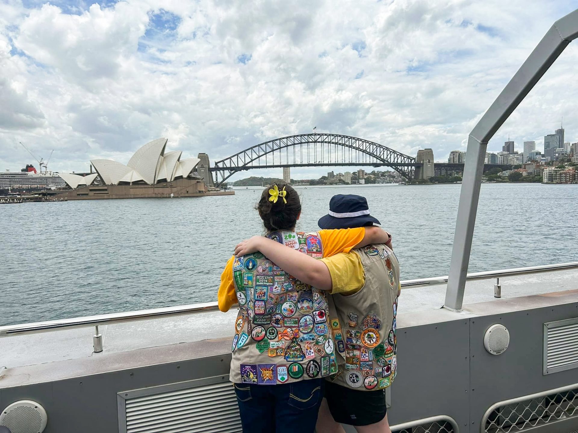 two girl scouts gazing at the sydney opera house in australia