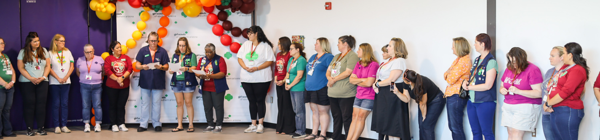  ceo standing at volunteer event speaking to volunteers 