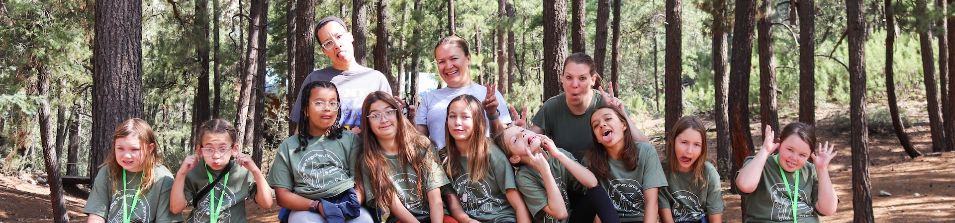  brownie girl scouts smiling at a bridging event 