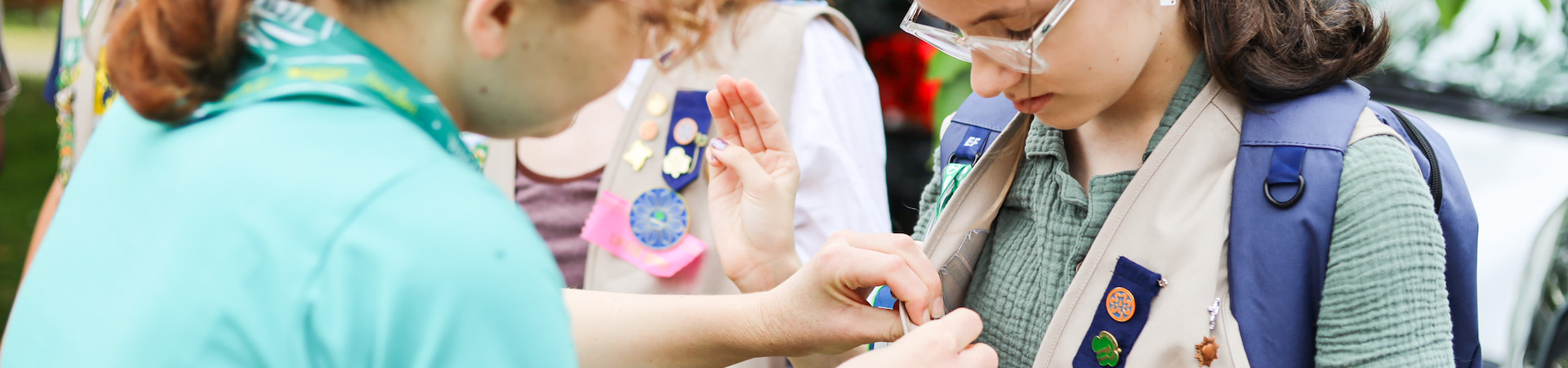  girl scout at pax lodge getting pinned 