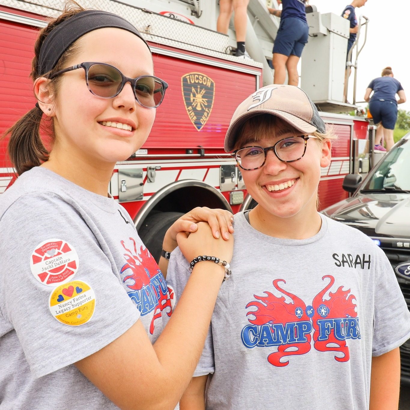 sara sloughfy smiling and posing with another camp fury girl scout