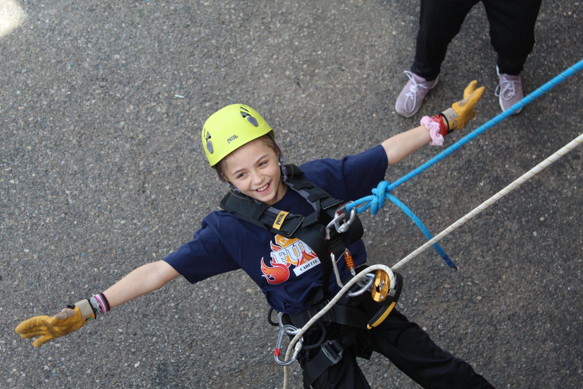 catching fury participant rappelling and smiling