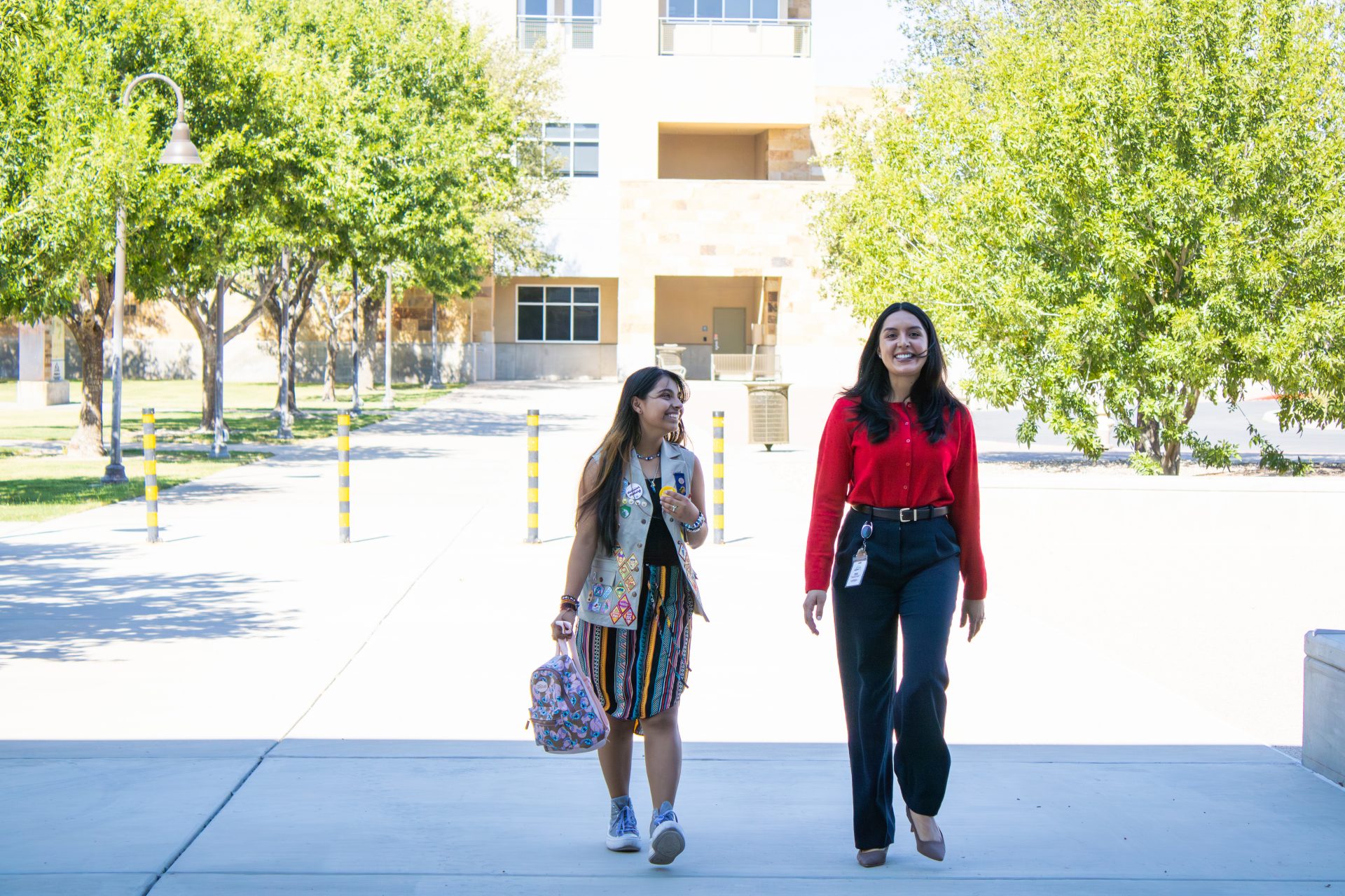girl scout takeover pair walking and laughing