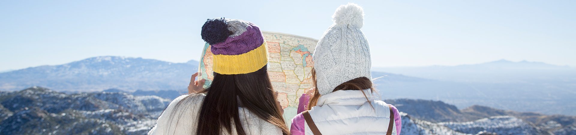 girl scouts looking at a map at a summit
