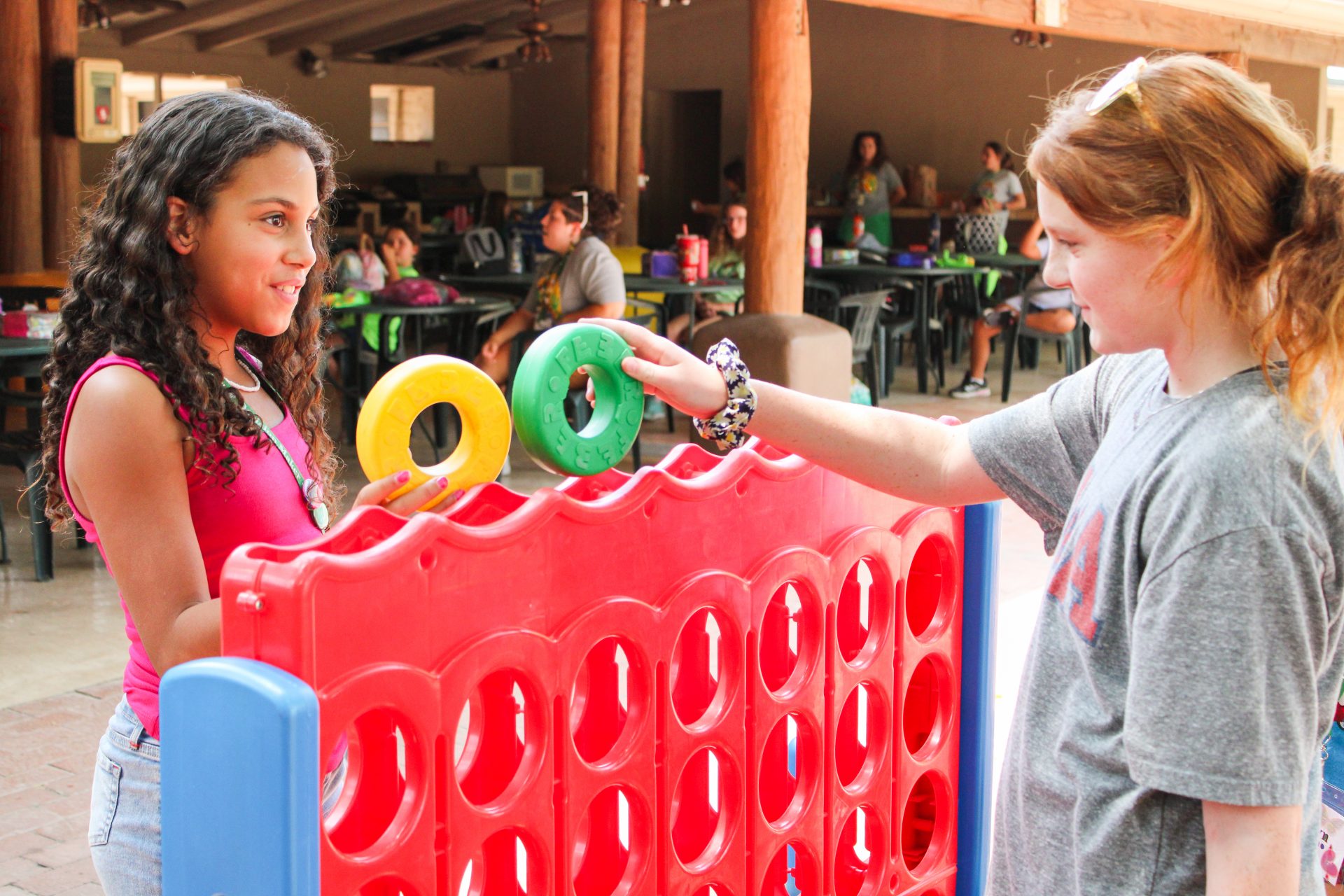 girl scouts friends at the hacienda bonding over camp activity